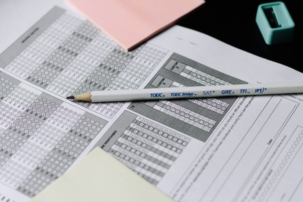 a white pencil on a multiple choice exam paper