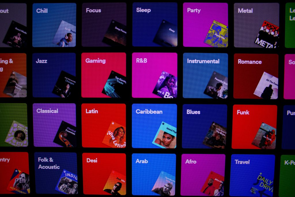 a screen showing different music genre categories.