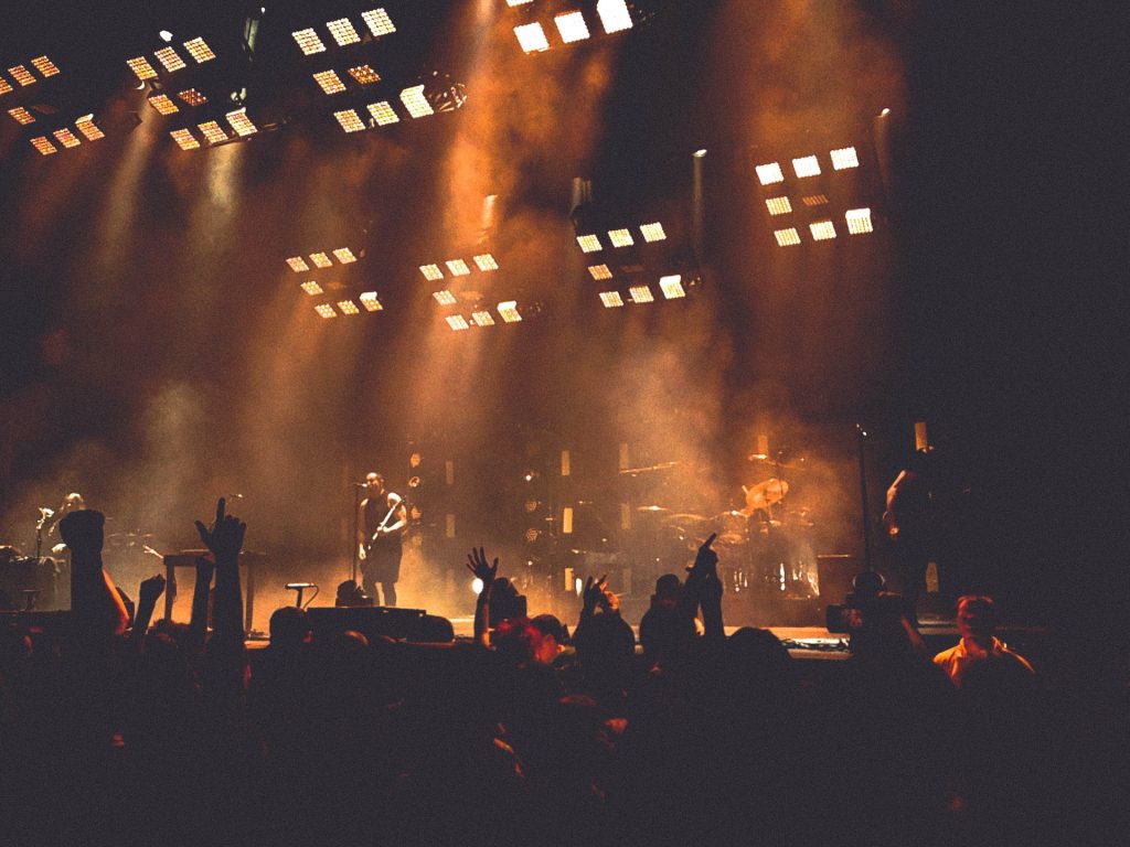 a view of a band on stage from the crowd