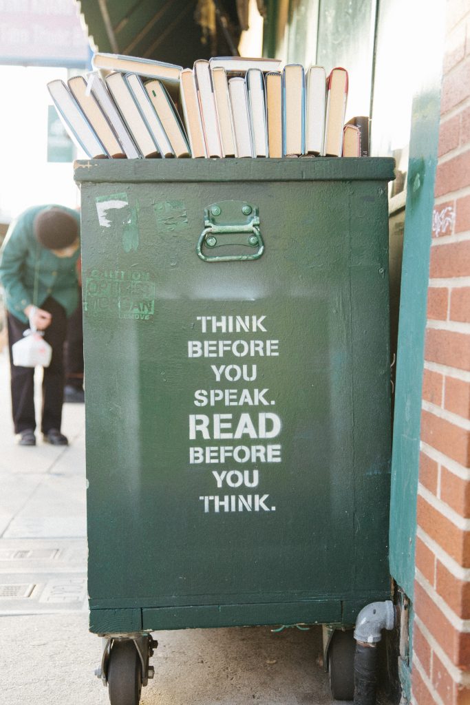 green book trolley with "think before you speak. Read before you think." stencilled on the side.