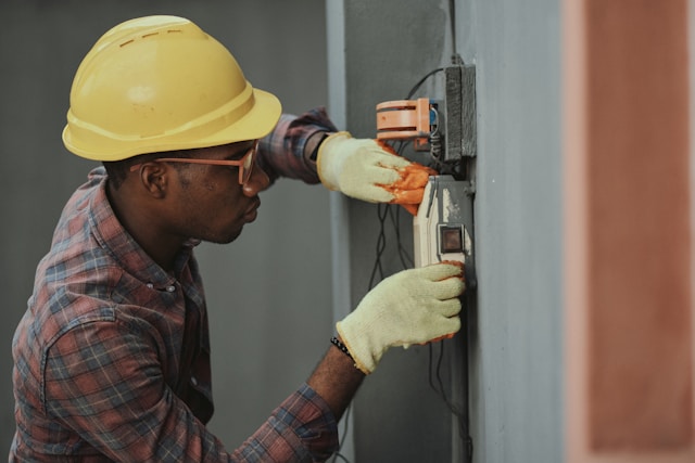 construction worker fixing wall